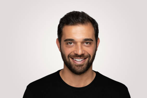 istock Laughing  handsome young man over isolated  gray background 1204826134