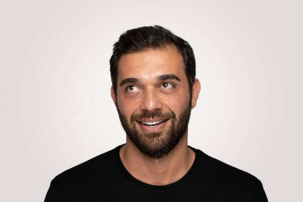 istock Laughing  handsome young man over isolated  gray background 1204826197