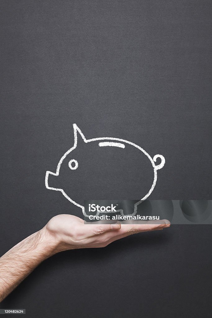 chalkboard con mano e Salvadanaio a porcellino - Foto stock royalty-free di Affari