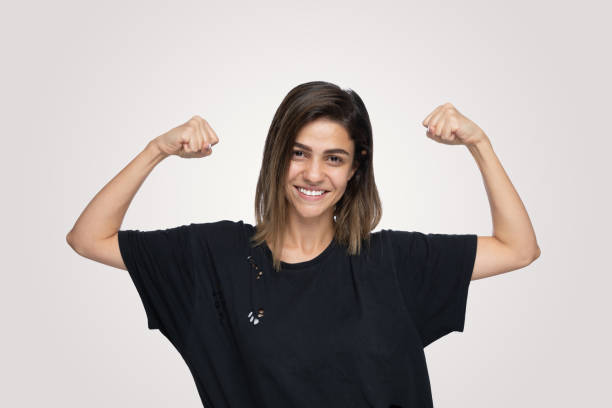 istock Excited Young Women Shaking Fists 1204828195