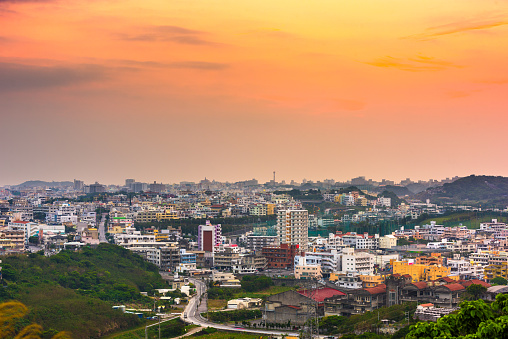 Urasoe, Okinawa, Japan town skyline at twilight.