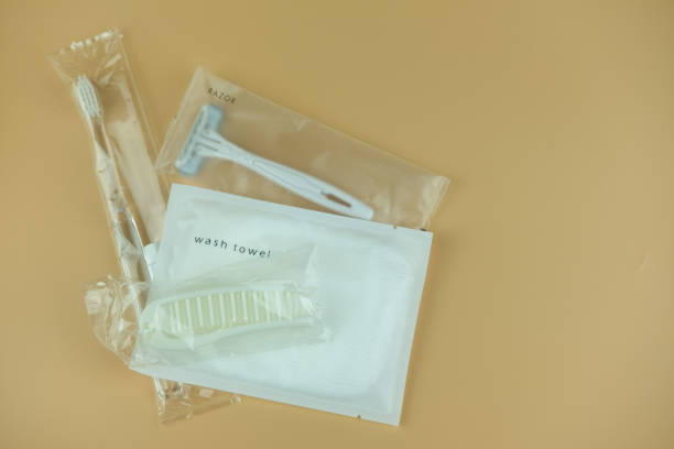 istock Travel set, toothbrush, toothpaste, razor and comb. Travel set on a yellow background. 1204835312