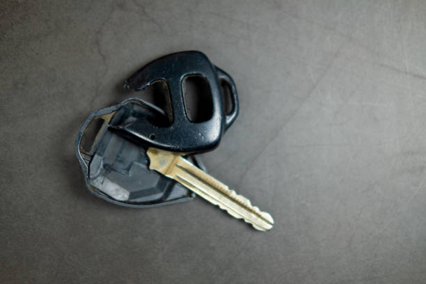 Hand holding keys to new car