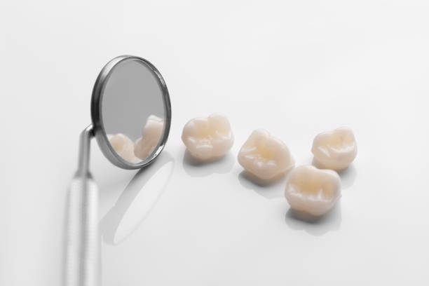 istock dental tools with teeth on blue background top view 1204837798