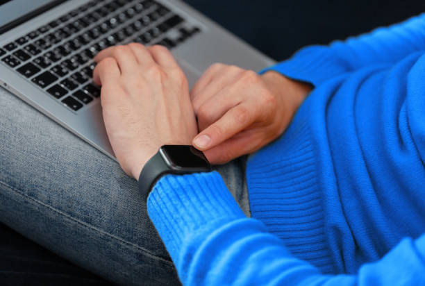 Men's hand touching digital watch
