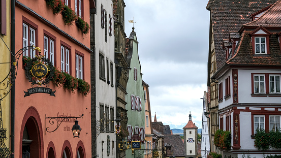 Rothenburg ob der Tauber, Bavaria, Germany - October 10, 2019: Looking down one of the fairytale streets in medieval Rothenburg ob der Tauber.  This historic town with colorful half-timbered houses is part of the famous German Romantic Road.