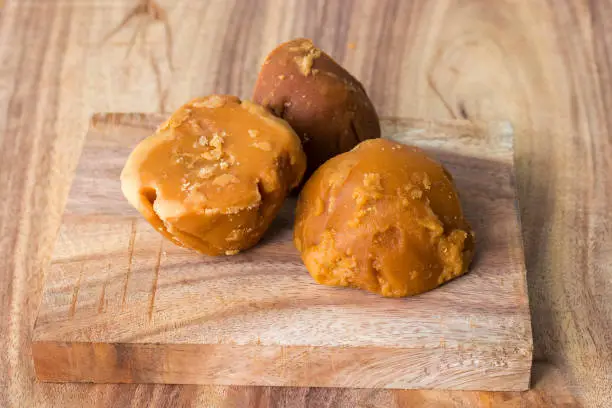 Photo of sweet and delicious Jaggery,decorated with wooden background