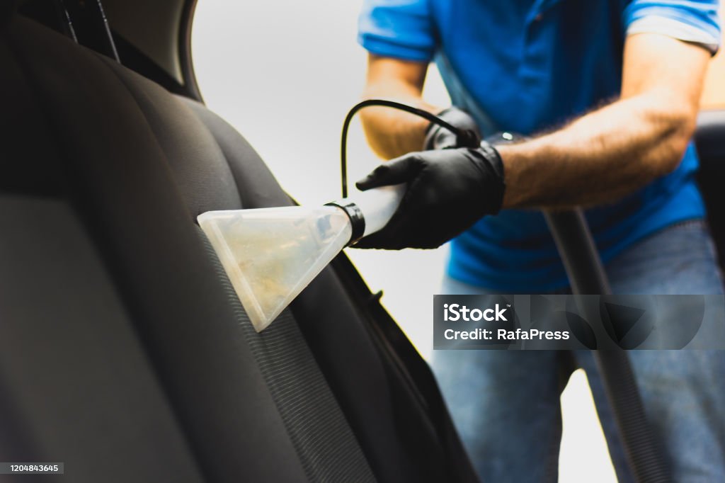 Man Does Car Upholstery Cleaning Professional Chemical Cleaning With  Suction Method Hygienic Work And Stain Removal On The Vehicle Seat Stock  Photo - Download Image Now - iStock