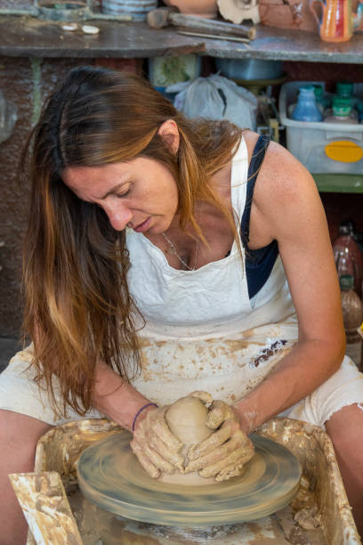 istock Artist working in her atelier 1204844686