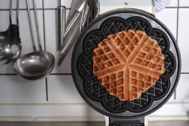 istock High Angle View Of Vegan Waffle In Maker In Kitchen 1204844822