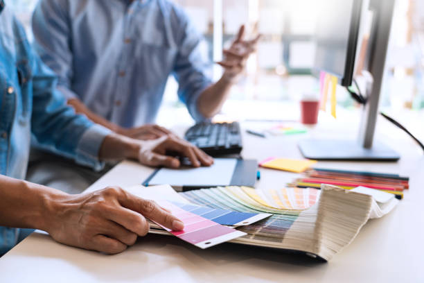 istock Midsection Of Business People Working Together While Discussing At Office 1204847175