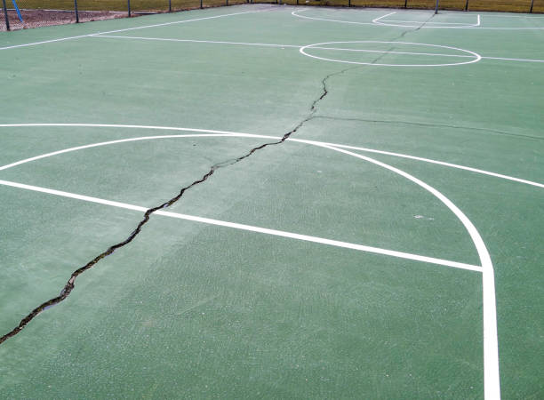 istock Empty basketball playground outside in cloudy winter day 1204848047