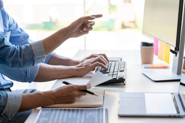 istock Midsection Of People Working In Office 1204850018