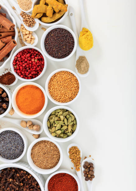 istock Spices and herbs flat lay, white background, top view. 1204850246