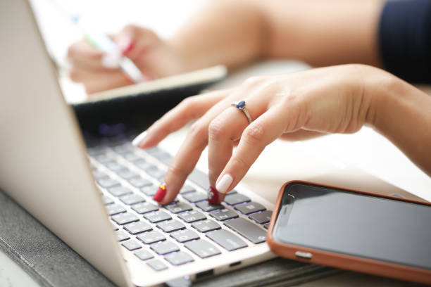 istock Cropped Hands Of Woman Using Laptop 1204852055