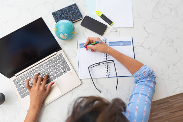 istock High Angle View Of Woman Working On Table 1204852139