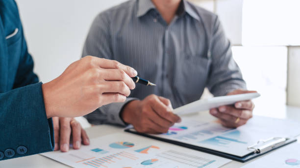 istock Midsection Of Business People Working In Office 1204856393