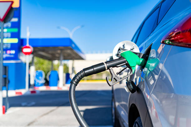 Filling the car with gasoline at gas station.