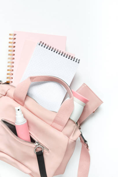 istock Flat lay, Women's accessories pink backpack, glider, water bottle and spray for the face on a white background, trend things girl generation z, fashion background 1204858000