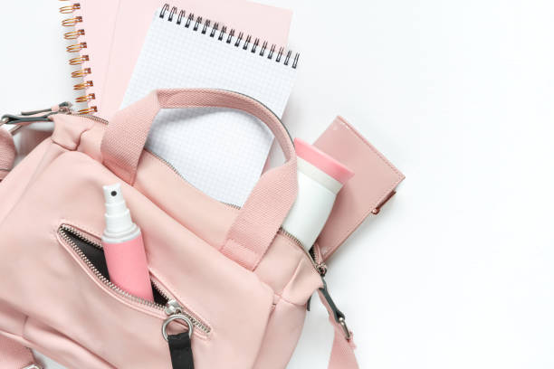 istock Flat lay, Women's accessories pink backpack, glider, water bottle and spray for the face on a white background, trend things girl generation z, fashion background 1204858007