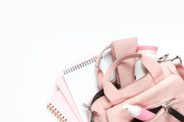 istock Flat lay, Women's accessories pink backpack, glider, water bottle and spray for the face on a white background, trend things girl generation z, fashion background 1204858035