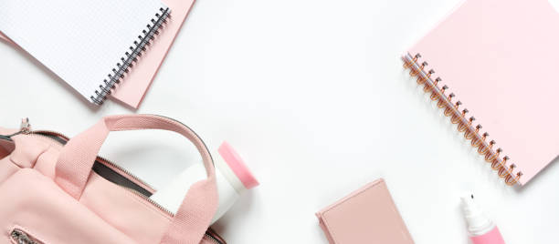 istock Flat lay, Women's accessories pink backpack, glider, water bottle and spray for the face on a white background, trend things girl generation z, fashion background banner 1204858150