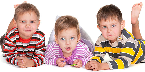 istock Funny lying kids in striped shirts 120485856