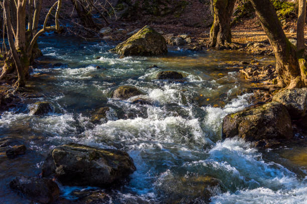 Fast flowing cascading water on rocks in the river in Turkey.