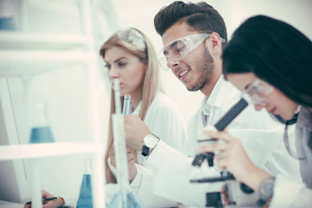 istock close up. group of doctors analyzing data on the coronavirus 1204865887
