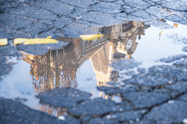 istock Colorful puddle reflection of an old building. 1204866854