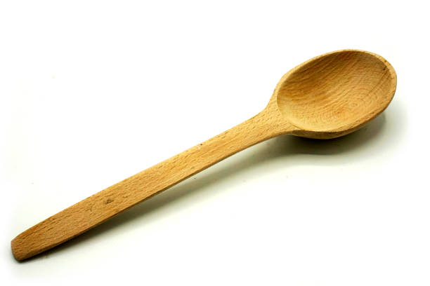 istock Wooden kitchen utensils on white background. Handcrafted wooden spoon. 1204869440