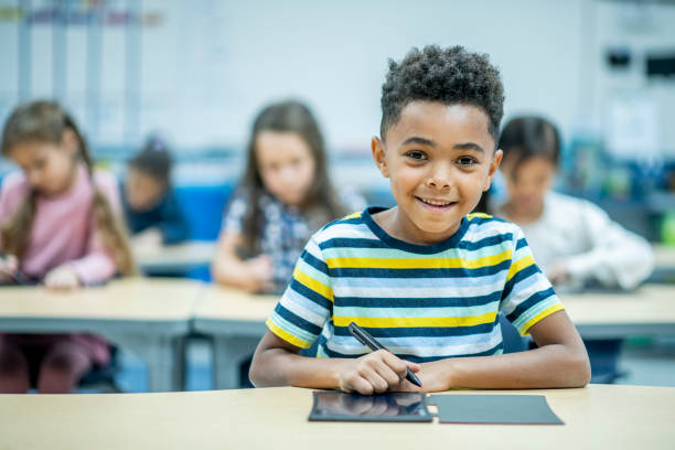 istock African Boy Using a Digital Slate stock photo 1204871781
