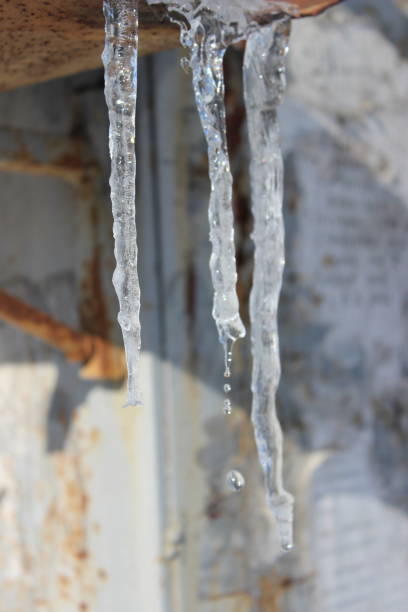 istock Icicles on the roof in spring time 1204871974