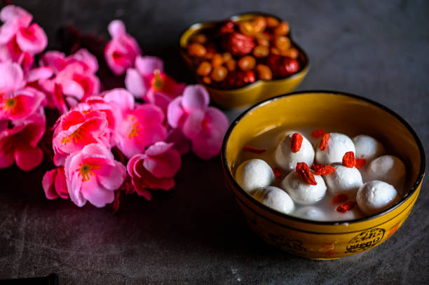 istock Tangyuan, peanuts, dates, Wolfberry and flowers on the table 1204873934