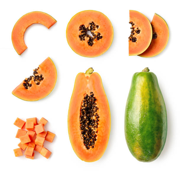 Set of fresh whole and half papaya fruit and slices Set of fresh whole and half papaya fruit and slices isolated on white background, top view papaya stock pictures, royalty-free photos & images