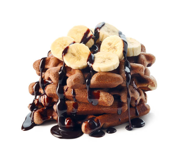 istock Belgium waffles with chocolate sauce and banana slices 1204875421