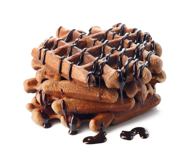 Belgium waffles with chocolate sauce on white background