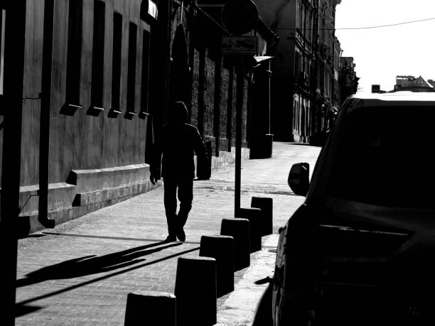 istock A man is walking on the sunlit street 1204877692