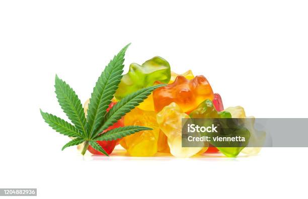 Gummy Bear Medical Marijuana Edibles With Cannabis Leaf Isolated On White Background Stock Photo - Download Image Now