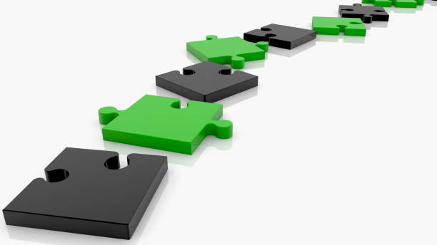 istock Path of puzzle pieces in  black and green 1204883133