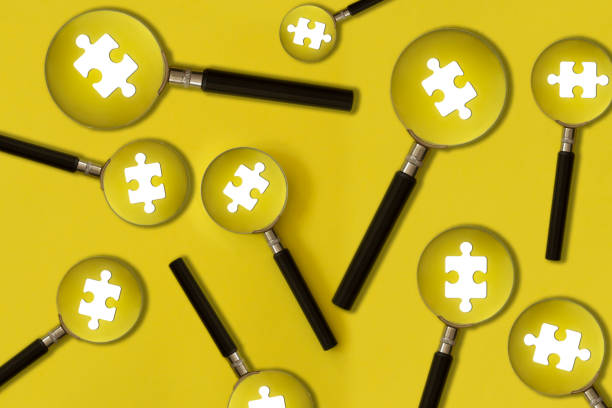 Many Magnifying Glass on a Puzzle Piece stock photo