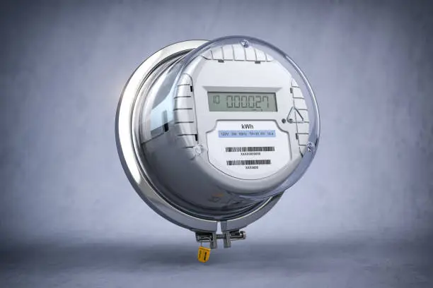 Photo of Digital electric meter with lcd screen  on grey dirty background. Electricity consumption concept.