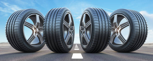 istock Four car wheel oln the highway with sky background.  Change a tires. 1204884618