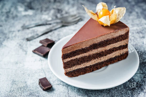 istock Chocolate cake with chocolate cream filling decorated with physalis 1204886870