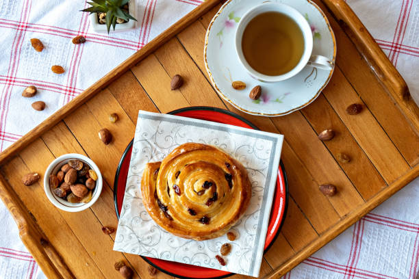 istock Pastry french rolls with honey and dry grapes 1204887016
