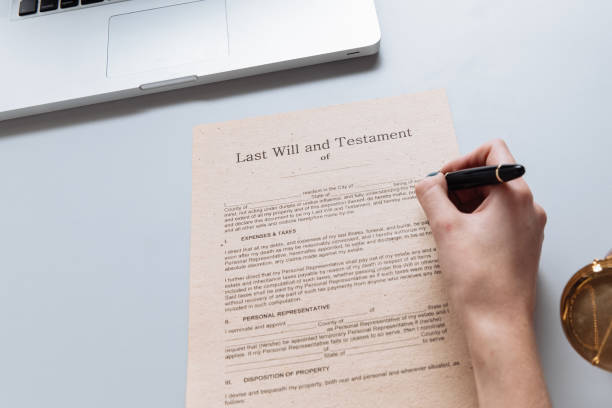 istock Notary woman writing by the pen on the documents 1204889117