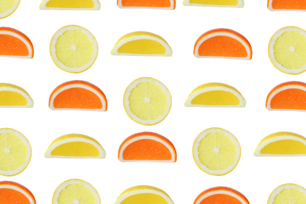 istock cut orange and lemon in a white background 1204890872