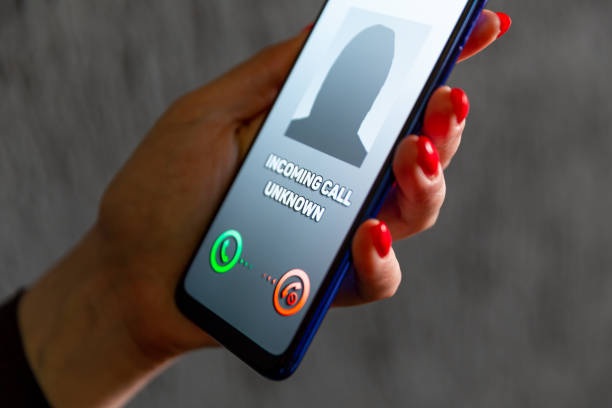istock Phone call from unknown number. Scam, fraud or phishing with smartphone concept. Prank caller, scammer or stranger. Woman answering to incoming call. Hoax person with fake identity. 1204891025