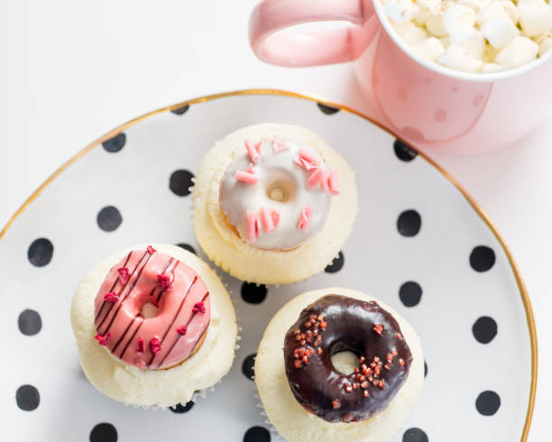 cupcakes with icing and small decorative donuts