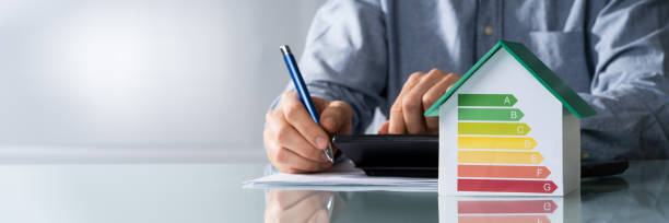 istock Businessman Calculating Energy Efficiency Rate 1204893091